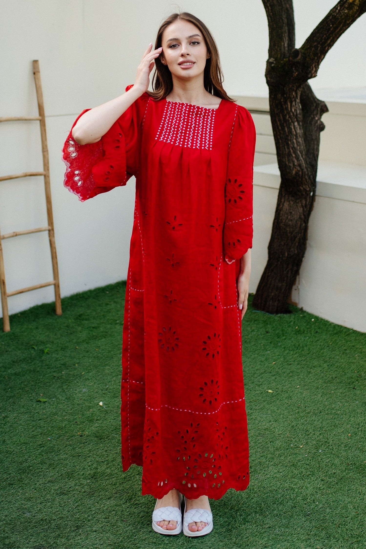 Eyelet embroidered linen dress with cutout details and hand stitch