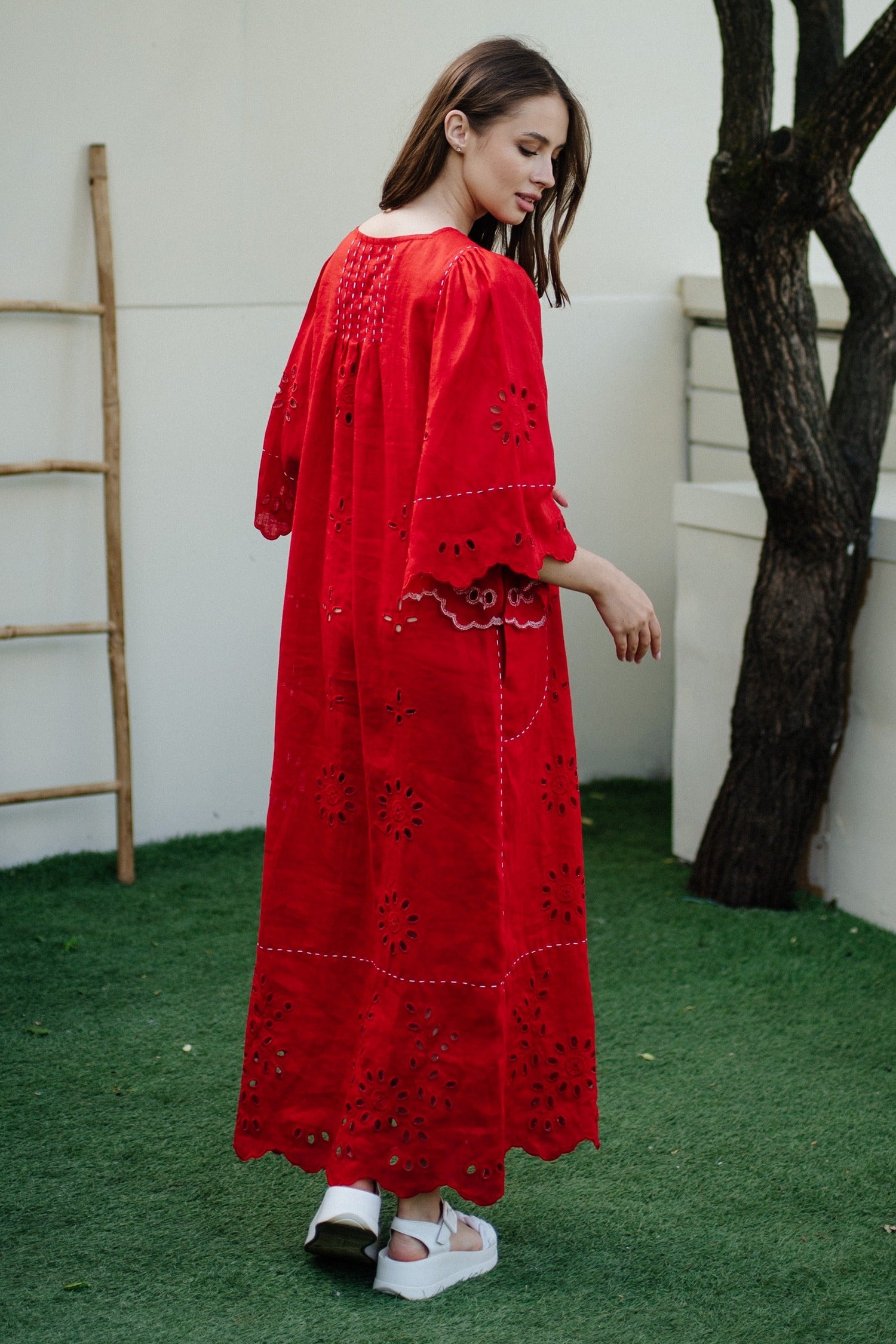 Eyelet embroidered linen dress with cutout details and hand stitch